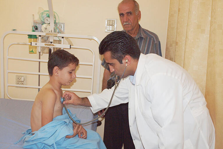 Dr Nablus of St Luke's Hospital attends a young patient.
