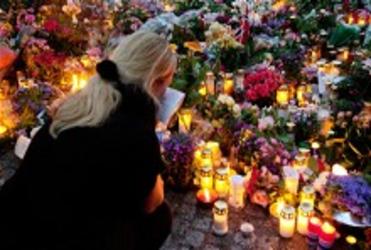 Flowers are placed in Oslo in response to the killings in Norway. 