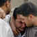 A grieving Iraqi is consoled by friends after the Baghdad hostage killings.