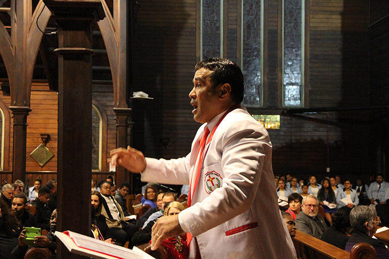 The conductor of the United Church of Tonga at work. The conductor of the United Church of Tonga at work.
