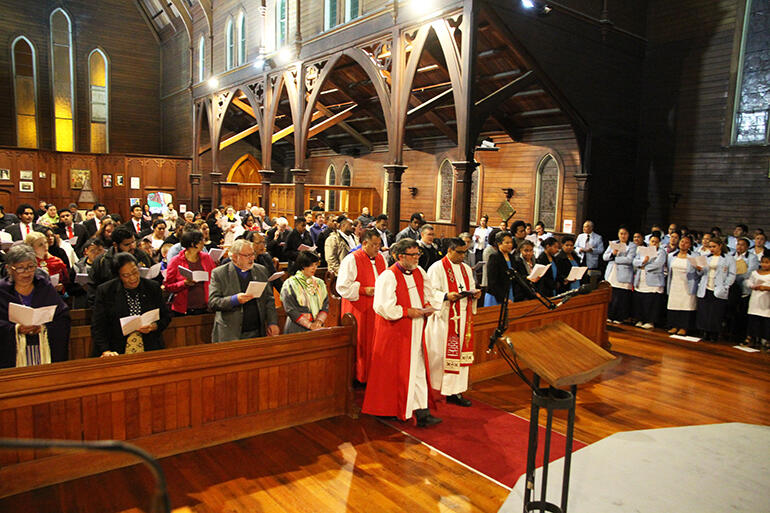 The service begins. That's Archbishop Philip alongside the Rev Prince Devanandan, followed by Bishop Kito Pikaahu. The service begins. That's Archbishop Philip alongside the Rev Prince Devanandan, followed by Bishop Kito Pikaahu.