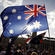 Australian pilgrims brandish their flag at the canonisation of Mary MacKillop.