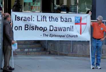 Members of the Middle East Task Force of the Diocese of Los Angeles hold a vigil outside the Israeli consulate.