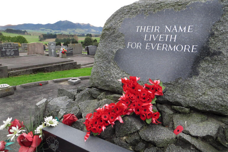 Poppies adorn a war memorial after ANZAC Day in Gore, Southland.