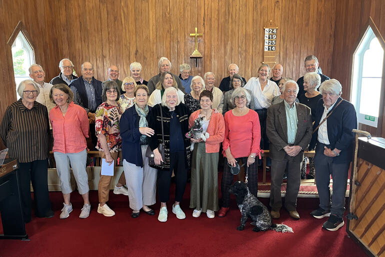 Still glad to be Anglican: John Bluck (2nd left of the cross) joins his church whānau at St Leonard's Matakana, Warkworth Parish.