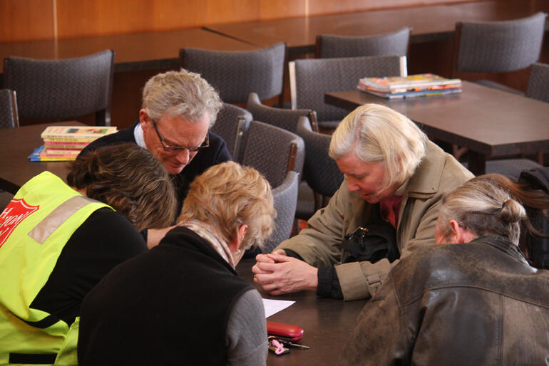 Bishop Victoria leads a prayer for the people of Kaiapoi.