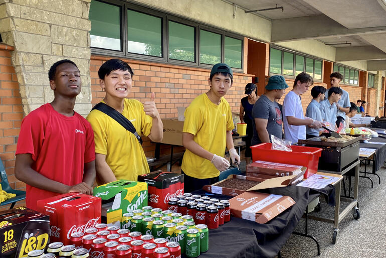 Dilworth School prefects sell food and drinks to fundraise at the House to House event.