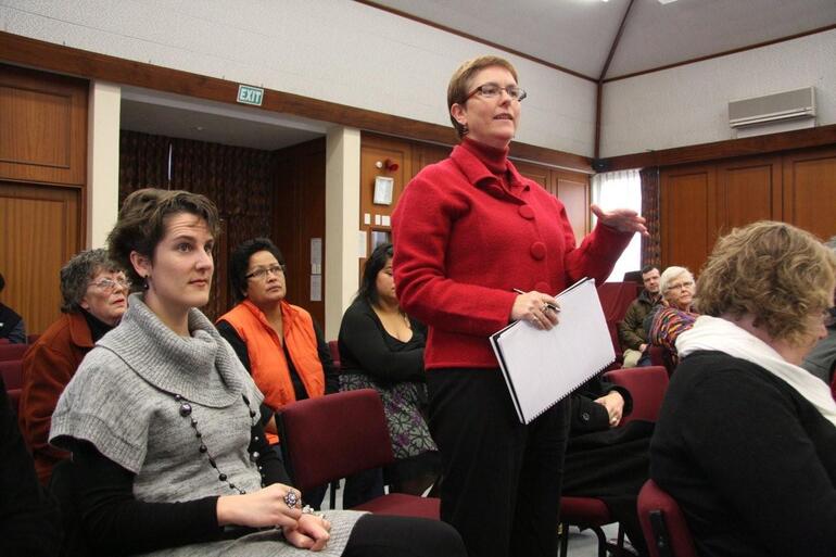 The Rev Helen Jacobi, Dean of St John's Cathedral in the Diocese of Waiapu, puts a question to Bishop Katharine. The Rev Helen Jacobi, Dean of St John's Cathedral in the Diocese of Waiapu, puts a question to Bishop Katharine.