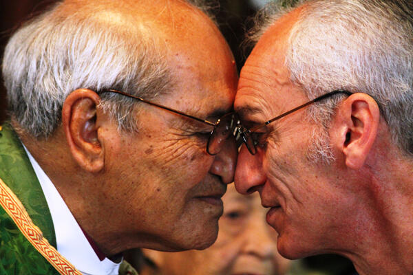 Archbishop Brown and the Rev Tom Poata, the Vicar of St Faith's, exchange a hongi after the special presentations.