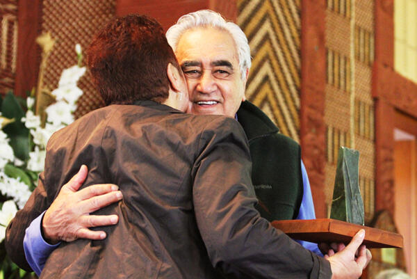 Mrs Helen Gray presents Miki Thompson with a pounamu taonga in recognition of his service to Te Wai Pounamu.