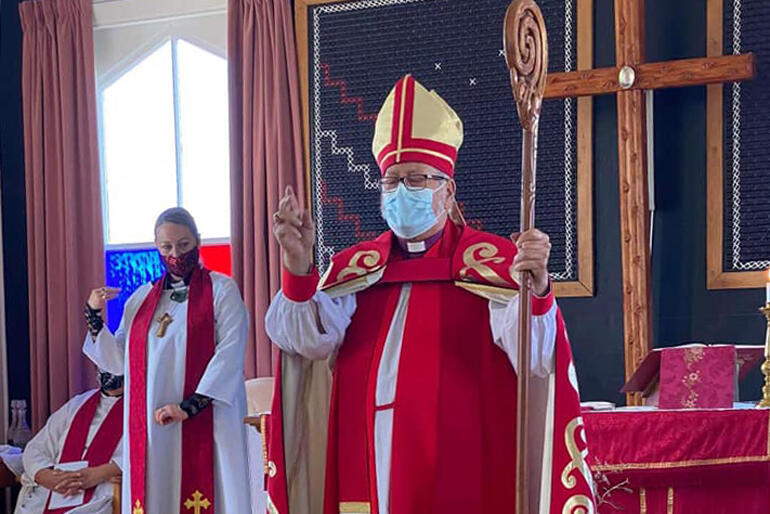 Pīhopa Richard Wallace blesses people joining the service with ordinations and commissioning at Aperahama Church in Murihiku.