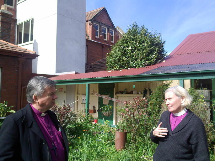 Bishops David and Victoria discuss options for housing the Community of the Sacred Name. The white structure is a lift tower. Bishops David and Victoria discuss options for housing the Community of the Sacred Name. The white structure is a lift tower.