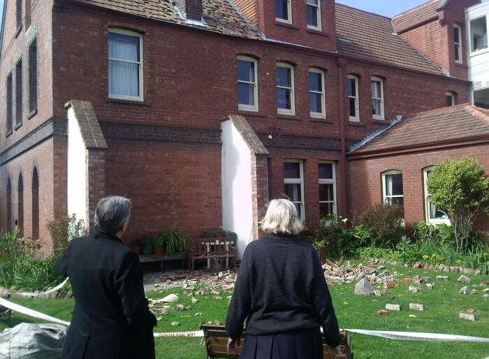The bishops consider the condemned two-storey brick building where the six sisters at the CSN had lived. The bishops consider the condemned two-storey brick building where the six sisters at the CSN had lived.