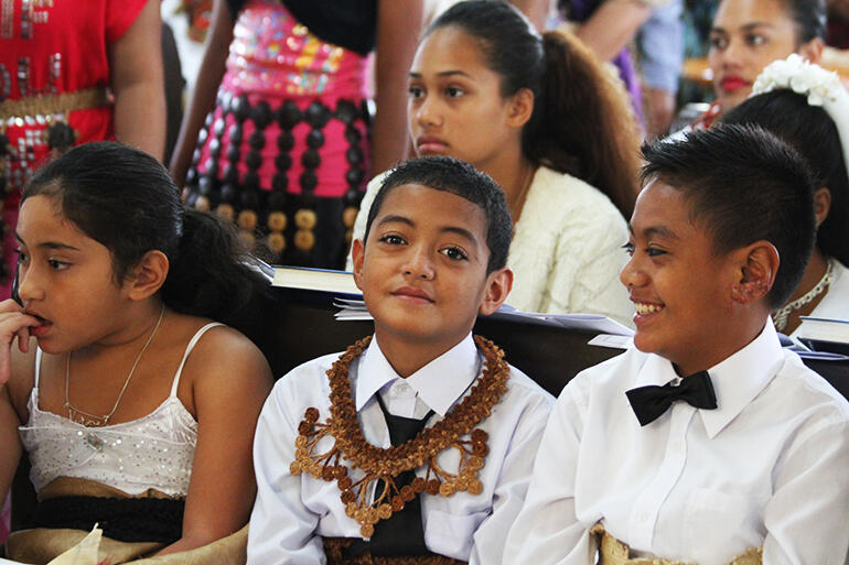 Confirmation candidates Sisilia Evelini Faletau (left) Geoffrey Talanoa and Willis Halaapiapi, with K.Faletau at the back, awaiting their moment.