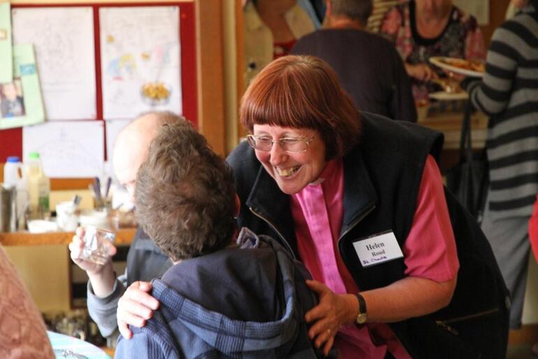 The Rev Helen Roud greets a guest at one of St Chad's Linwood's regular Friday community lunches. 
