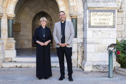 Archbishop of Canterbury Sarah Mullally and Anglican Archbishop in Jerusalem Hosam Naoum stand in the stone arch doorway at St George's College Jerusalem