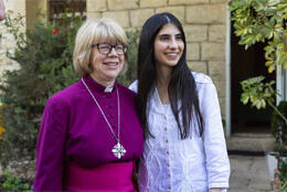 Archbishop Sarah Mullally stands next to Palestinaina Christian young woman Layan Nasir 