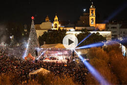 Huge Christmas tree stands in a Bethlehem night lit by thousands of lights in 2025 