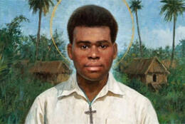 Portrait of Saint Peter To Rot in white shirt with cross, standing before a PNG village