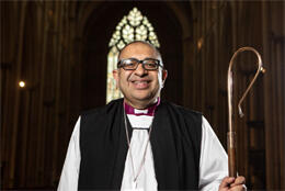 South Asian UK bishop stands in his cathedral