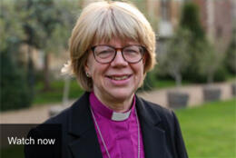 Bishop Sarah Mullally looks into the camera in a purple clerical shirt and tidy blond bob