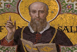 A colored mosiac depistcs the face and raised hand of St Francis de Sales