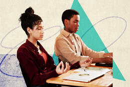 Two school students sit with eyes closed in contemplation