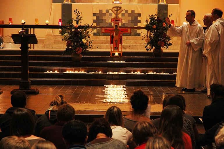 Brothers Alois, Ghislain and Matthew stand near the completed resurrection cross.