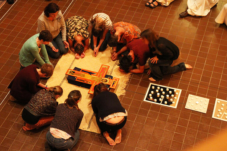 Droves of young people seized the opportunity to pray around the cross.