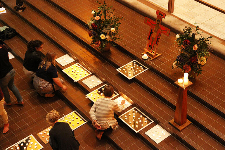 Lighting the candles to celebrate the resurrection of Christ.