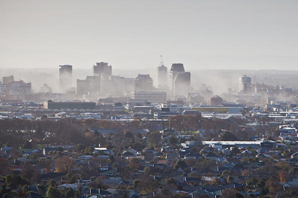 Christchurch sends up a cloud of dust as further buildings crumble in Monday's 6.3 quake. 