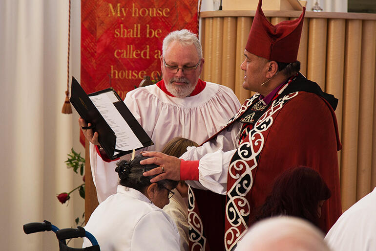 Bishop Kito anoints the Rev Irene Nelson. That's Michael Graveston supporting him. Bishop Kito anoints the Rev Irene Nelson. That's Michael Graveston supporting him.