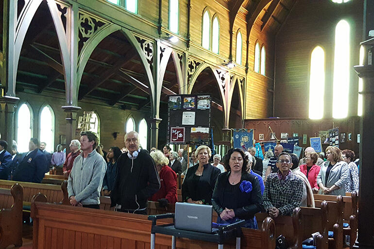 All stand as the ministry party processes into the church. Photo by Ukarau Kakepare. All stand as the ministry party processes into the church. Photo by Ukarau Kakepare.