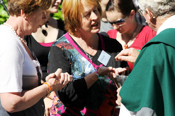 Rev Philip Robinson distributes the host at St Barnabas.