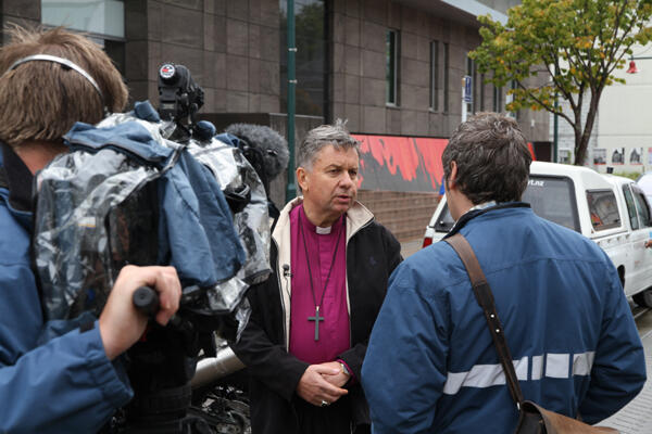 A TV journalist quizzes Archbishop David Moxon on the place of God in such devastation. A TV journalist quizzes Archbishop David Moxon on the place of God in such devastation.