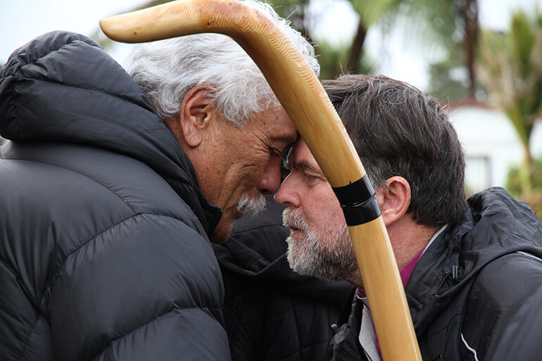 Mahara Okeroa exchanges the breath of life with Archbishop Philip Richardson.