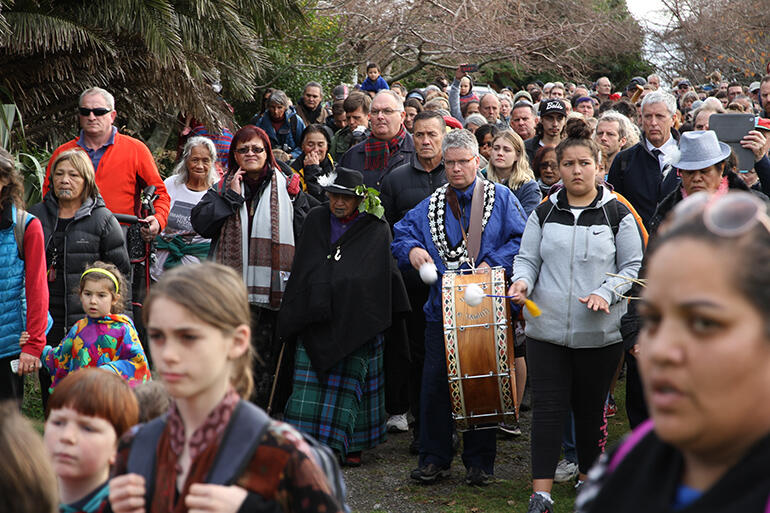 Mayor Judd beats Haruru ki Tawhiti as he leads the 500 walkers on to Parihaka pa.