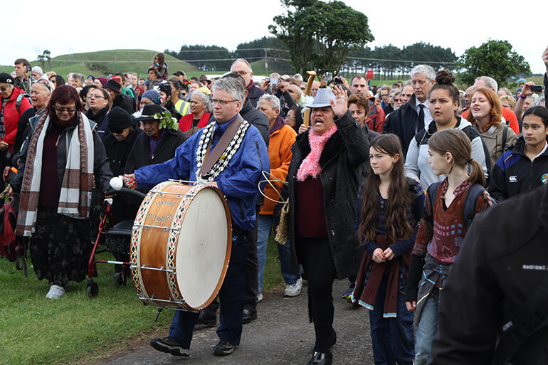 New Plymouth's soon to step down mayor, Andrew Judd, leads the peace walkers on to Parihaka.