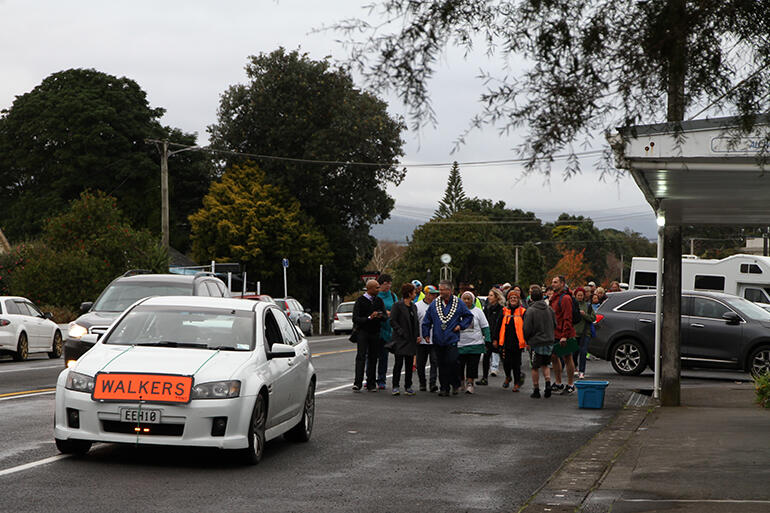 The peace walkers leave Okato, at the beginning of their last day's journey.