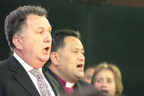 Shane Jones and Bishop Kito leading a waiata.