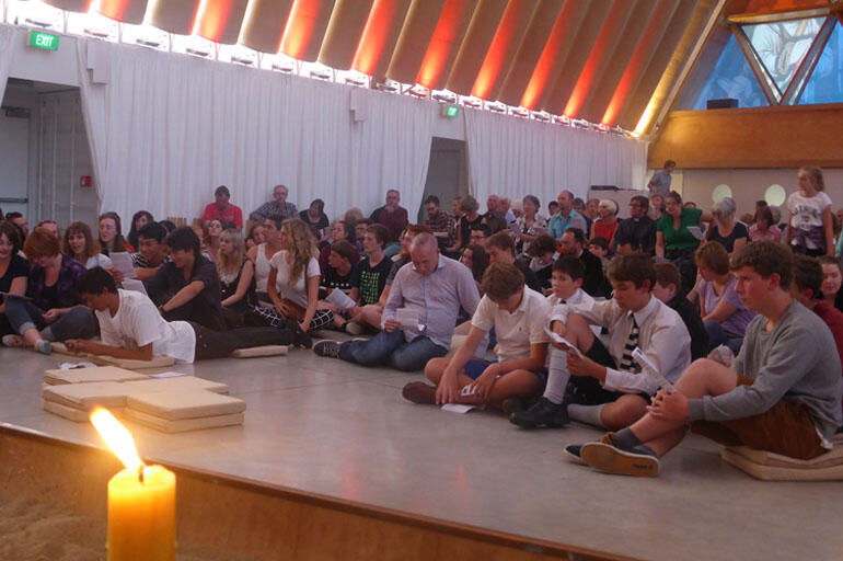 The Taize brothers lead worship in the Transitional Cathedral.
