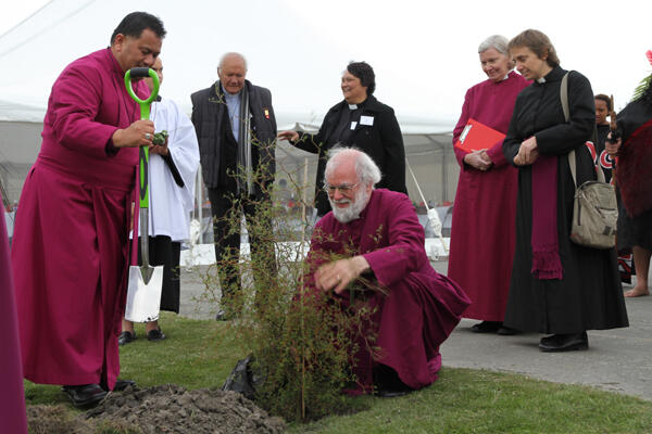 Archbishop Rowan plants a kowhai on the site where Waipounamu will erect a new church and community centre. Archbishop Rowan plants a kowhai on the site where Waipounamu will erect a new church and community centre.