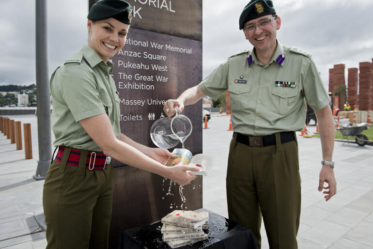Second Lieutenant Claire Debrois and NZDF Chaplain Lance Lukin test the waterproof New Testaments at Pukeahu National War Memorial Park, Wellington. Second Lieutenant Claire Debrois and NZDF Chaplain Lance Lukin test the waterproof New Testaments at Pukeahu National War Memorial Park, Wellington.