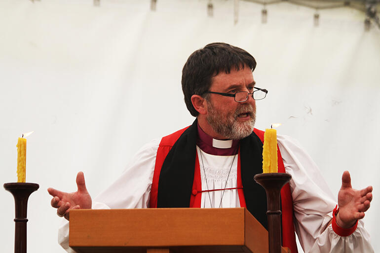 "Prepare to be disturbed": Archbishop Philip Richardson preaching his sermon.
