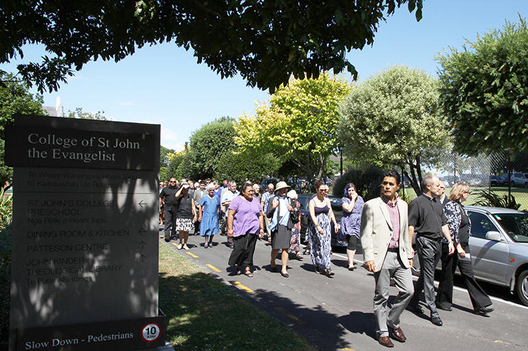 The manuhiri being called on to the marae - which was a marquee, pitched in the Cloisters' quadrangle.