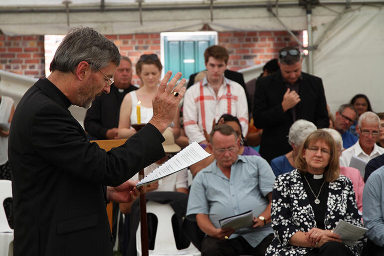 The Principal/Manukura of St John's College, the Rev Tony Gerritsen, blesses the students after they have been commissioned.