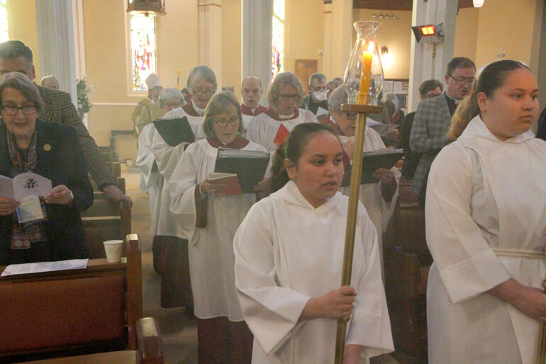 Cathedral servers and choir process into the hui opening mass. Cathedral servers and choir process into the hui opening mass.