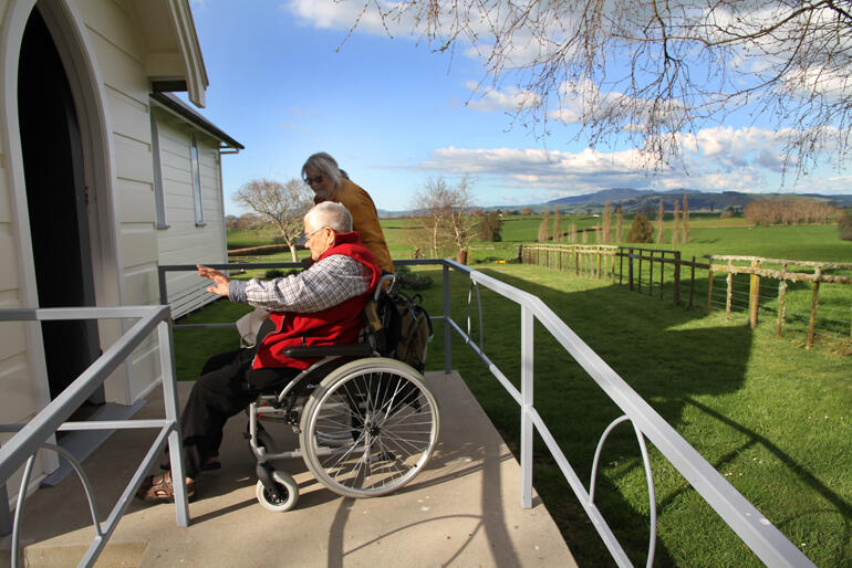 Members of the Anglo-Catholic Hui 2023 enter St Paul's Church Rangiaowhia via its concrete access ramp.