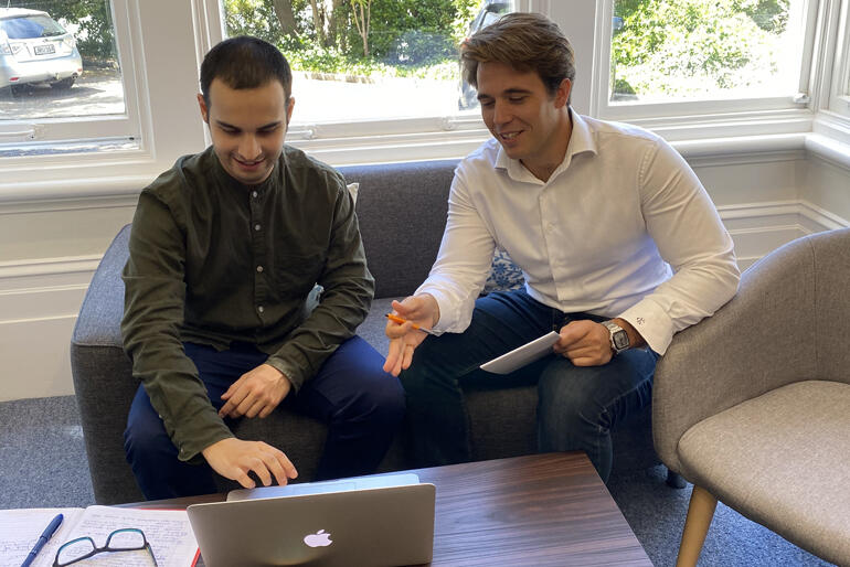 Interns Kaspar Flaws and Campbell Kerr work at Anglican Missions' headquarters in Thorndon, Wellington.