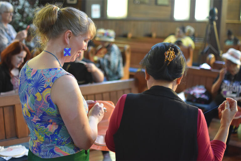 Miriam Fisher leads the 'stitching and talking theology' response to her presentation at the hui.